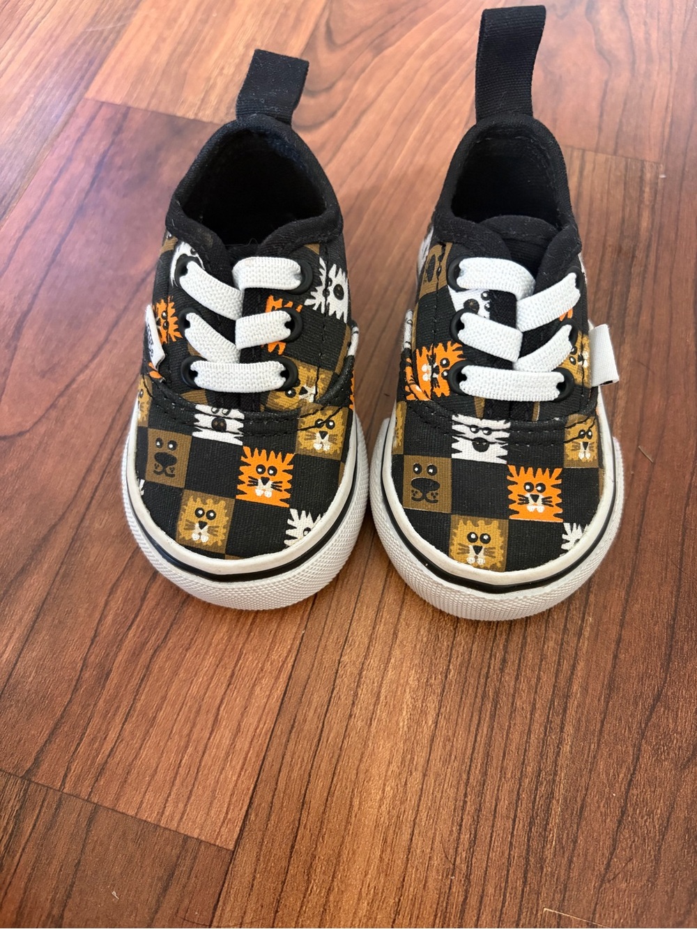 Vans baby Black, Orange & White Checkerboard Animal Slip-On Sneakers